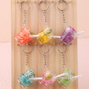Fruit juice drink cup keychains with miniature ice cubes and fruit slices in vibrant colors