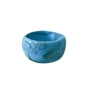 Modern wide lake blue resin bangle with grey marble ink pattern in minimalist style