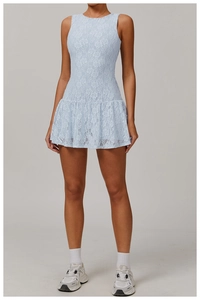 Detail of light blue sleeveless lace dress with intricate floral embroidery and pleated hem