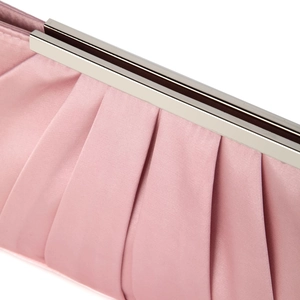 Detail shot of pleated pink satin evening clutch bag with silver metal frame and clasp