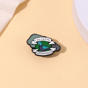 Funny pigeon enamel pin with white ribbon text on green background for clothing and bags