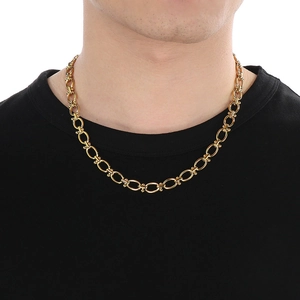 Detailed view of thick 18K gold plated Cuban link chain necklace on male model's neck