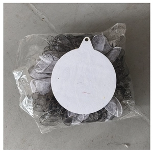 Detail view showing the sturdy white felt backing and black mesh trim of the skull wreath
