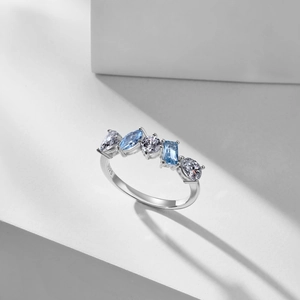 Macro shot of S925 sterling silver ring showing blue teardrop zircon and heart stone detail