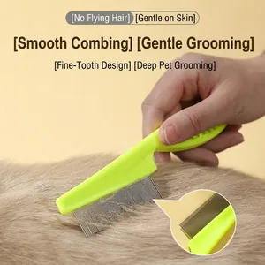 Pet grooming brush with stainless steel teeth and non-slip green handle for cats and dogs