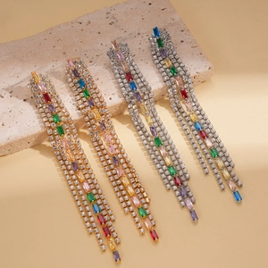 Elegant gold and silver tassel earrings with colorful zircons in a multi-color gradient