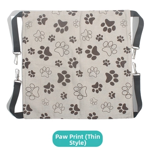 Flat lay of thin cat hammock with dog paw prints and metal hooks for cages