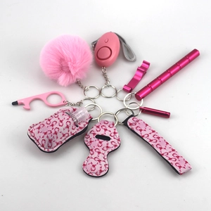 Pink personal safety keychain set with alarm window breaker and pompom accessory