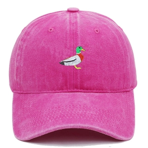 Detail of green duck embroidery on retro washed pink cotton baseball cap