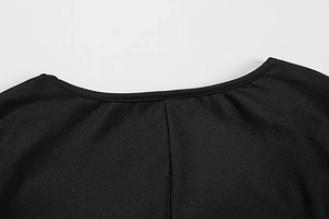 Detail of the high-quality round neckline and stitching on a black slim-fit dress