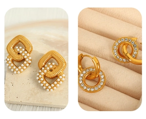 Detail of gold geometric pearl earrings and sparkling rhinestone hoop earrings