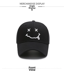 Detailed front view of black cotton baseball cap with white embroidered smiley face