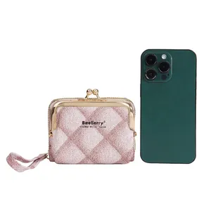 Mini checkered handbag wallet with gold clasp and strap shown beside a smartphone