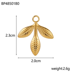 Macro view of gold leaf charm pendant with detailed veins and size measurements