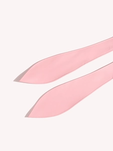 Detail of pink PU leather belt straps showing precise edge stitching and soft matte finish
