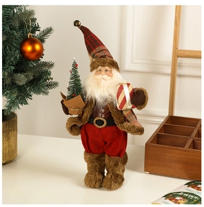 Detail of Santa figurine holding a mini Christmas tree and gift box in a cozy room