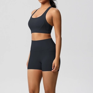 Detail view of high-waist yoga shorts with functional side pockets and seam structure