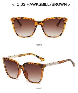 Detail of square tortoiseshell sunglasses with metal pearl temples and brown lenses