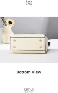 Close-up of beige lychee leather bag bottom with four protective gold metal studs