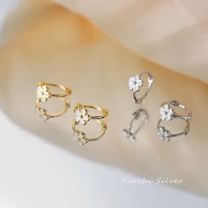 S925 sterling silver hoop earrings with white enamel flower charms in gold and silver