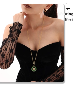 Wearing effect of golden snowflake pendant necklace with green enamel and sparkling stones