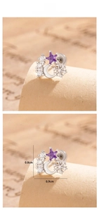 Detail showing a purple star zircon earring with dimensions measuring 0.8cm by 0.9cm