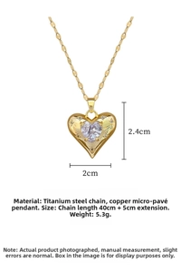 Macro shot of titanium steel necklace with heart pendant measuring 2.4cm by 2cm