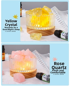 Detail view of crystal aromatherapy set with wood base, glass bowl and jasmine oil
