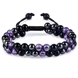 Detailed macro of hand-woven bracelet featuring obsidian and amethyst gemstone beads