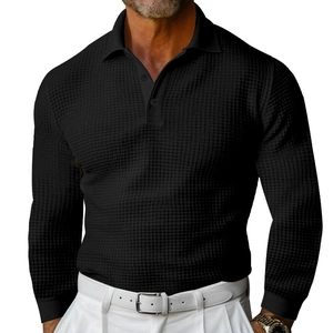 Detail of black waffle knit texture and two-button placket on men's long sleeve polo