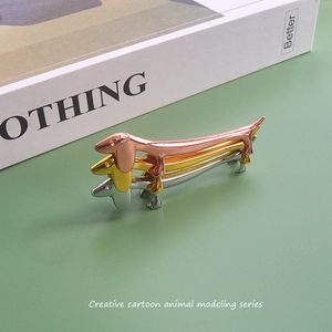 Creative dachshund-shaped metal chopstick rests in rose gold, gold and silver finishes