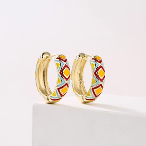 18K gold plated hoop earrings with colorful enamel geometric patterns on white pedestal