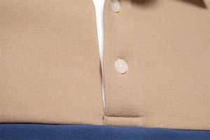 Detail of khaki and navy blue contrast knit fabric with high-quality resin buttons