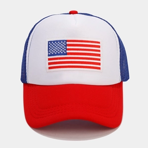 Detailed close-up of red and blue mesh trucker hat with American flag embroidery