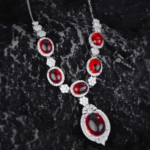 Vintage silver necklace with oval ruby gemstones and white zircon accents on black stone