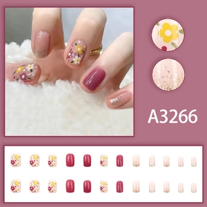 Short square press-on nails with purple floral patterns and glitter milky white gradient