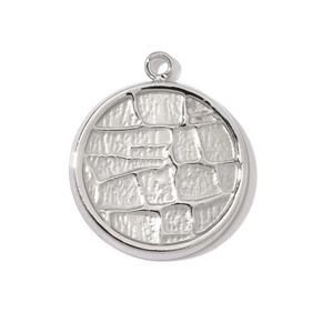 Macro shot of silver stainless steel round pendant with embossed stone texture detail