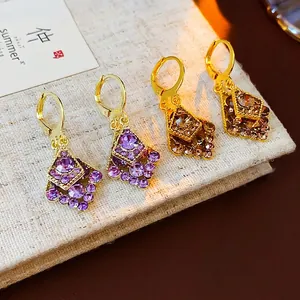 Elegant gold plated leverback earrings with purple and champagne diamond rhombus pendants