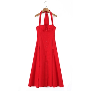 Detail view of red halter dress featuring a button-down front and side pockets