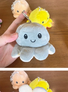 Detailed view of reversible plush octopus keychains in grey, yellow and orange colors