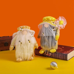 Set of two adorable bee-themed plush gnomes with yellow patterns and flower decorations
