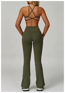 Detail of olive green backless yoga set featuring cross-strap bra and flared pants