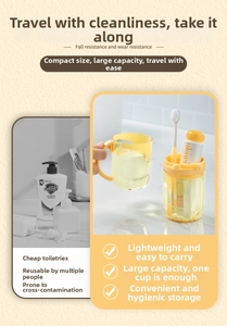 Detail of portable yellow travel toothbrush cup set with toothbrush and toothpaste
