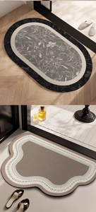 Detail showing the woven texture of absorbent bathroom mats in oval and wavy shapes