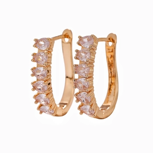 U-shaped rose gold earrings with white cubic zirconia in a minimalist geometric design