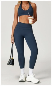 Detail of high-waisted navy yoga set showing the fabric texture and crossover bra design
