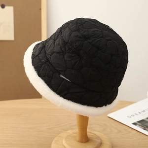 Winter quilted bucket hat in black with white faux fur trim and JINGSHANG label