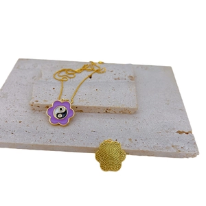 Golden necklace with purple enamel cherry blossom pendant featuring Tai Chi yin yang symbol