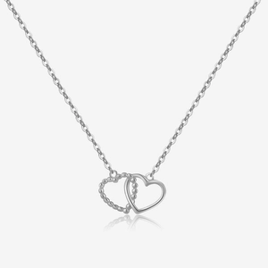 Detail view of S925 silver necklace with interlocking double heart pendant on white background