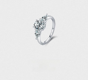 Macro detail of S925 sterling silver ring with sparkling round and pear-cut zirconias